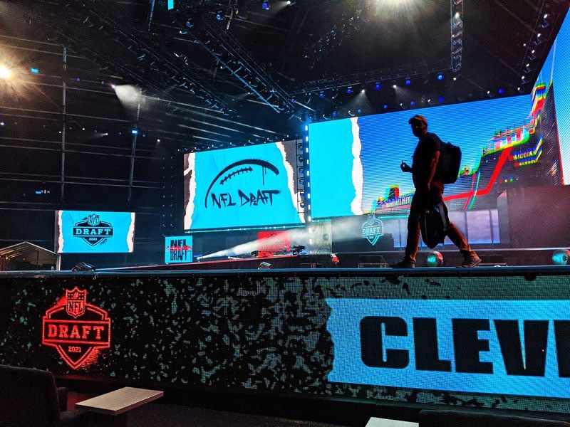 A Van Wagner production member checking stage lighting for the 2021 NFL Draft